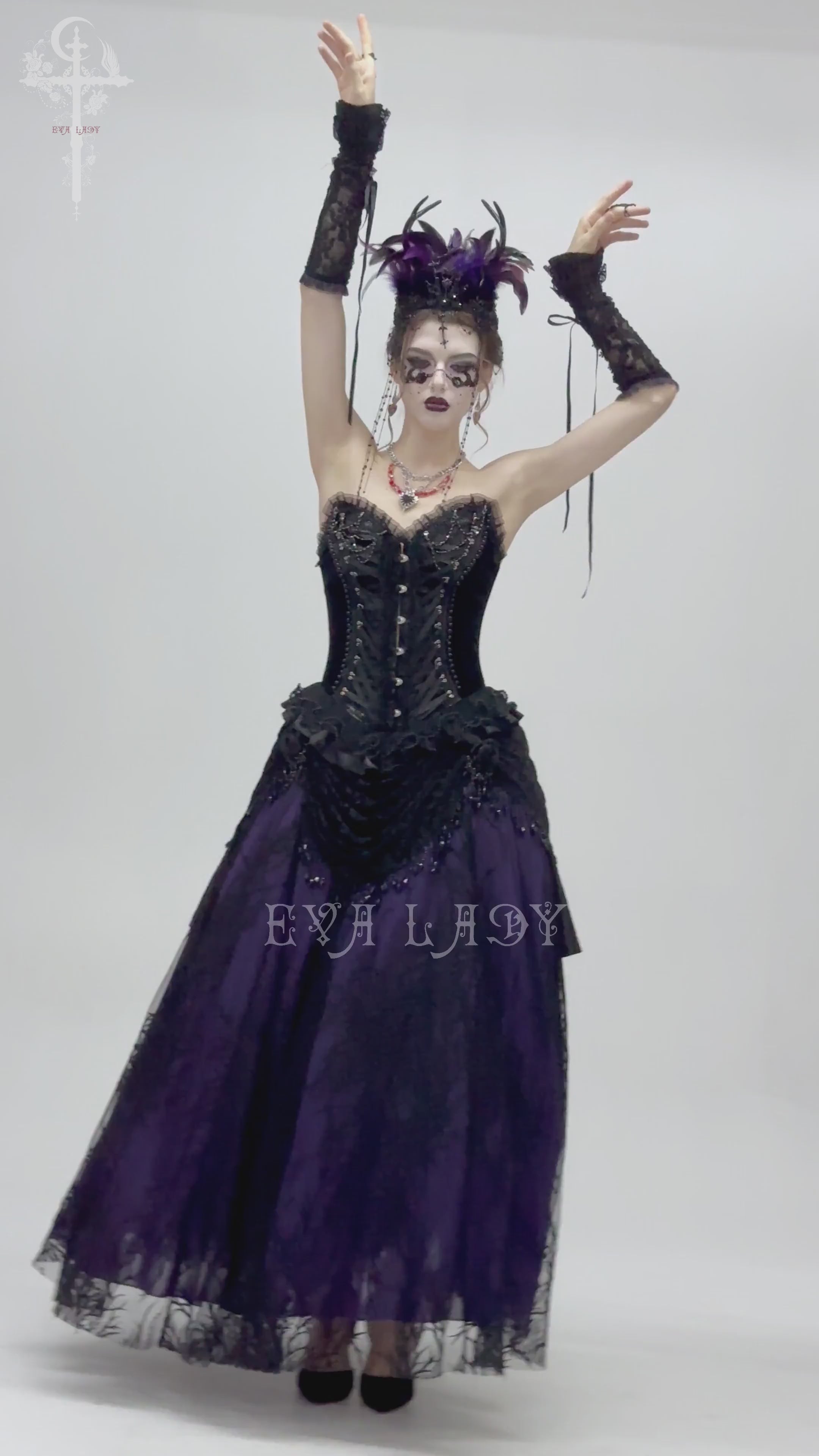 Bold gothic lace-up corset dress with ruffled trim and satin straps, perfect for a dramatic vintage look.