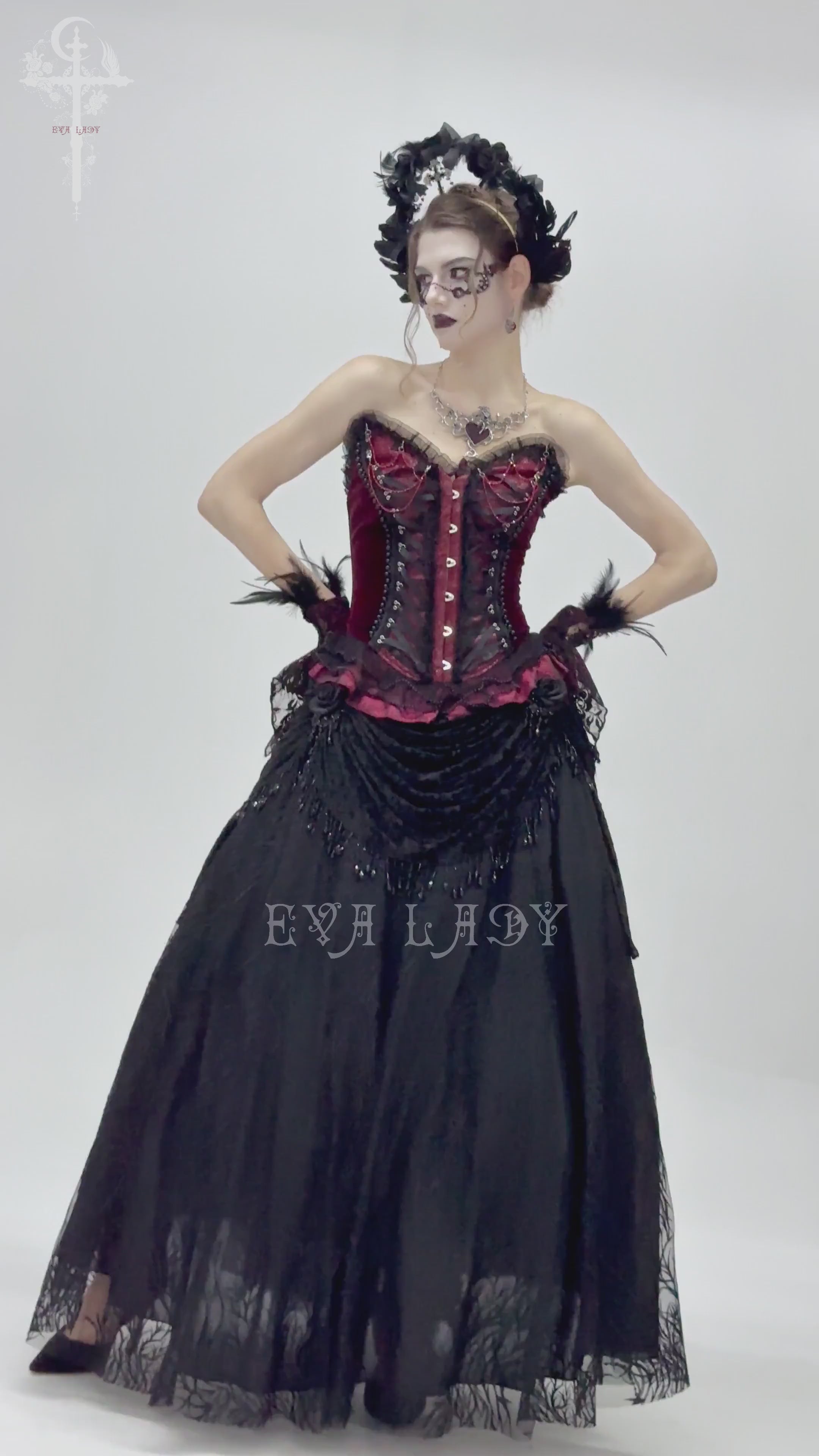 Burgundy gothic corset with lace trim, satin ribbon lacing, and ruffled hem for dramatic Victorian-inspired style.