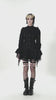 Gothic Lace Ruffle Long Sleeve Shirt with Button Closure worn by model in dramatic black ensemble.