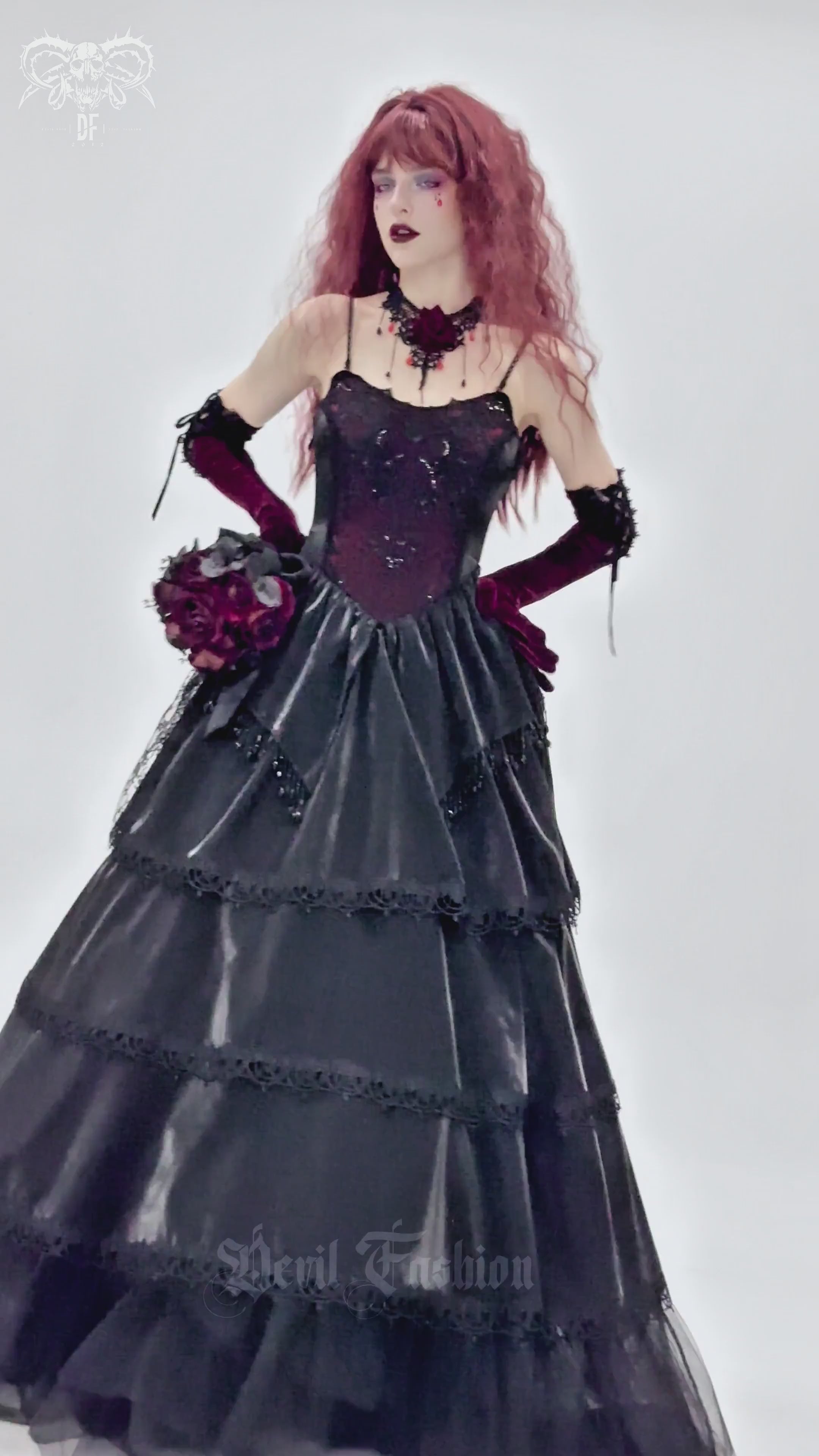 Gothic elegant corset dress with lace layers, beaded trim, and a dramatic layered skirt in deep black.