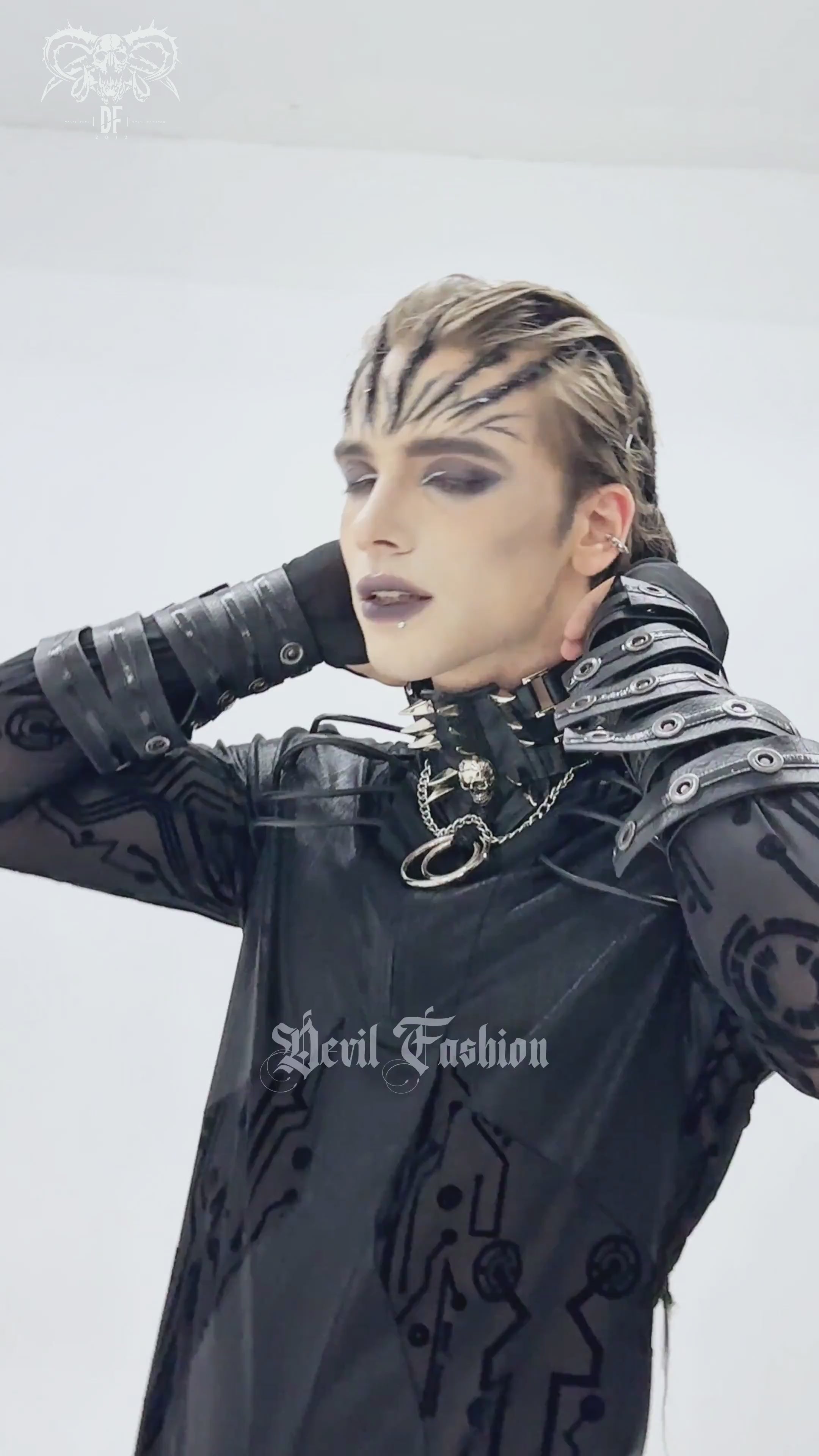 Bold Leather Choker with Spikes Accent and Metal Rings worn by a model in a dark fashion look.