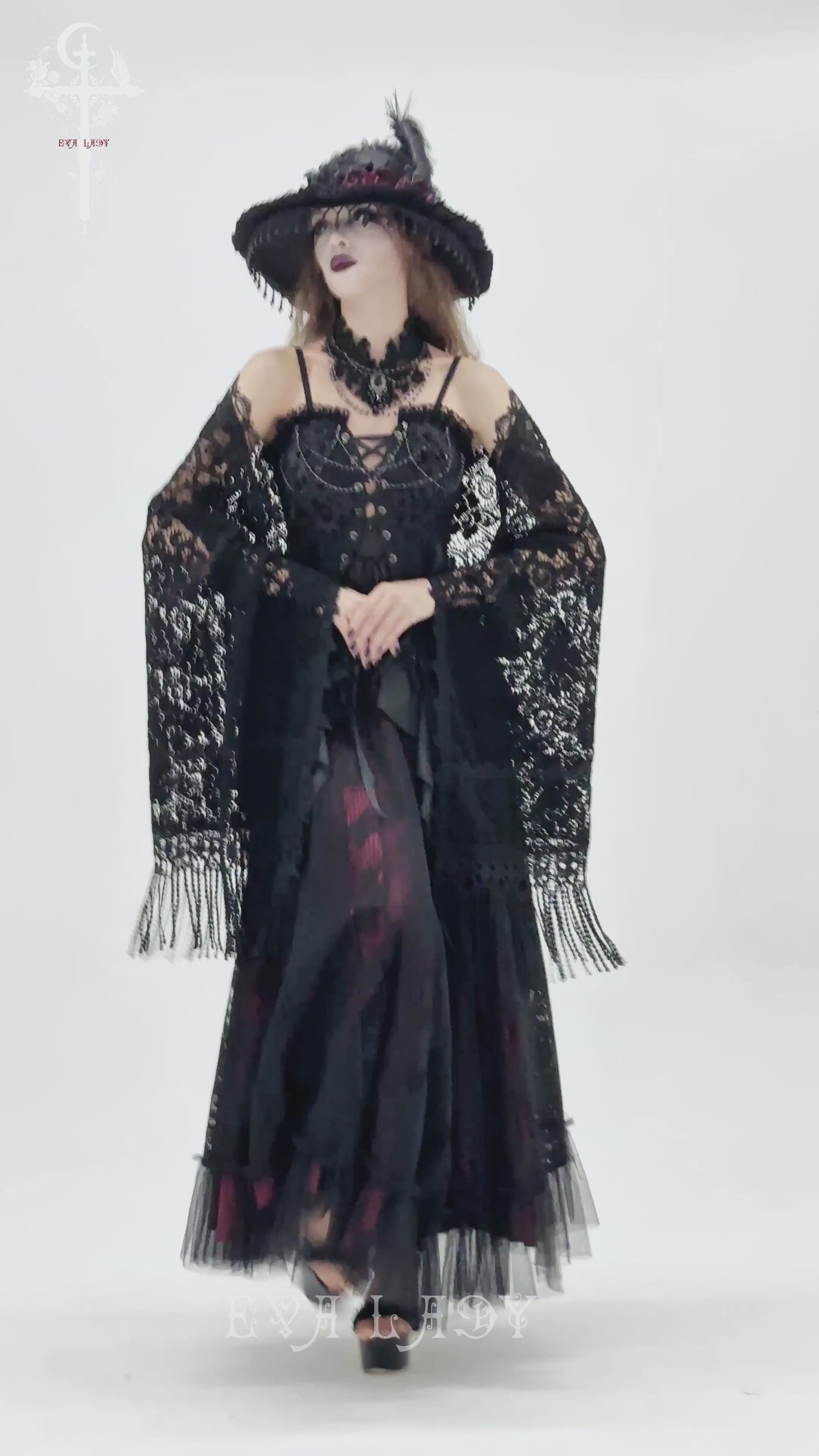 Black Lace Shawl with Fringed Hem for Gothic and Boho Style worn with a dramatic black gown and elegant accessories.