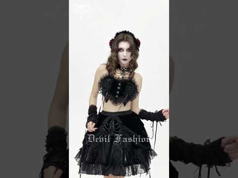 Female Black Lace Crop Top with Ruffle Trim Detail worn by model showcasing gothic fashion and accessories.