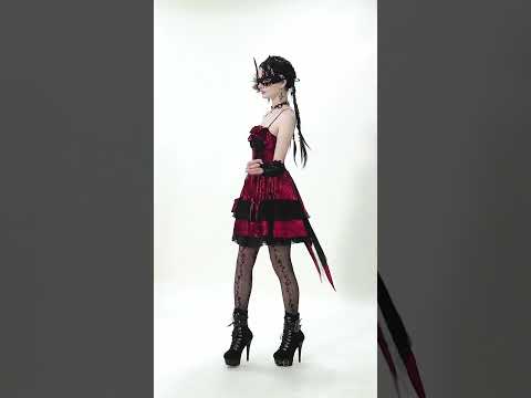 Gothic Lolita Mini Dress with Black Lace Details showcased on a model in gothic attire and striking accessories.