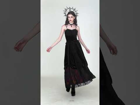Model showcasing the Gothic Velvet Maxi Skirt with Lace Overlay Panels in a stunning, dark setting.