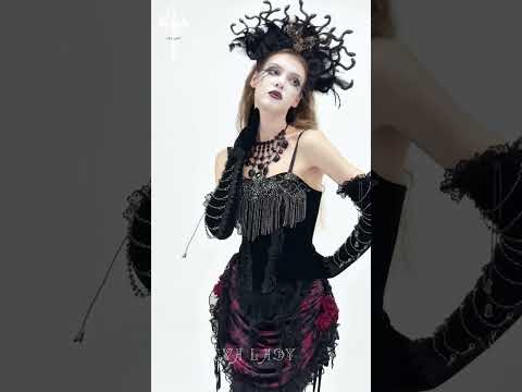 Alt Tag: Black Gothic Lace-Up Velvet Fringe Corset Top on model, black fringe corset with gloves and dramatic headpiece, gothic fashion look