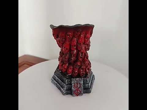 Horror Skull Tealight Holder for Gothic Decor featuring a resin design with carved faces and red column for dark accents.