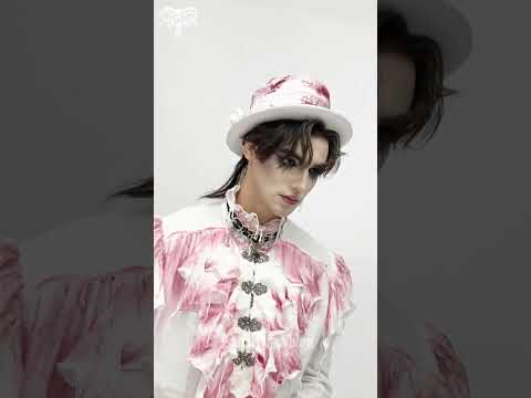 White Gothic Ruffle Shirt with Crimson Distressed Frills worn by a model in a stylish pose.