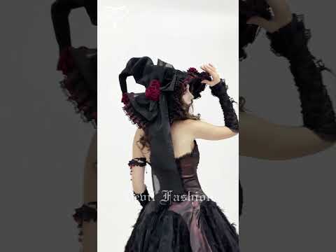 Goth Witch Hat with Roses and Sheer Ribbon Trim for Women worn by a model in a gothic outfit.