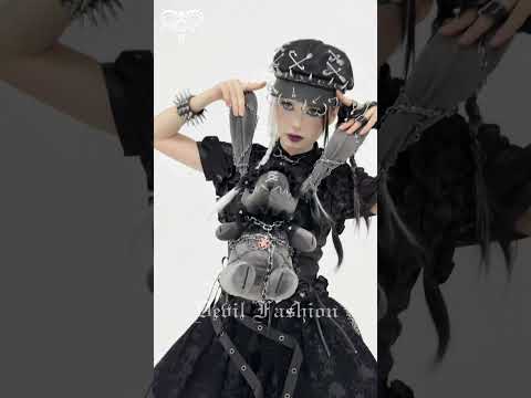 Dark Gothic Plush Bunny with Chains and Ruffles showcased in a dark fashion photoshoot with accessories.