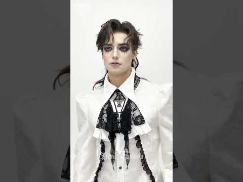 Elegant Lace Jabot Choker With Cross Pendant Charm worn with a dramatic gothic Victorian outfit.
