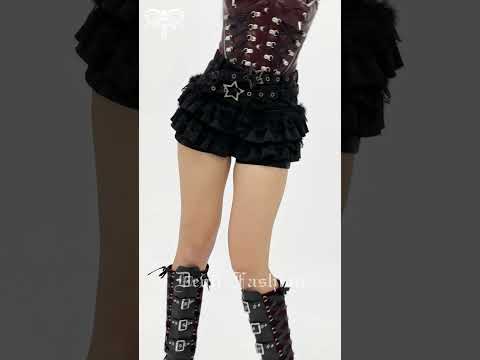 Black Gothic Ruffle Skort with Star Belt Detail paired with a stylish top and edgy accessories.