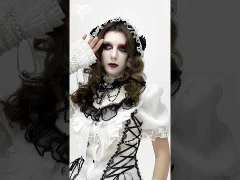 Female Victorian Blouse with Black Lace-Up Corset Back worn by model with dramatic makeup and accessories.