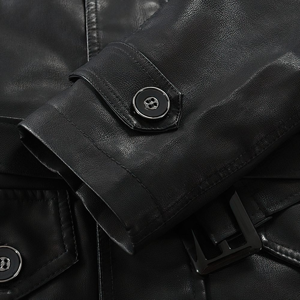Close-up of black PU leather men's jacket sleeve and button, showcasing stylish rock style design.