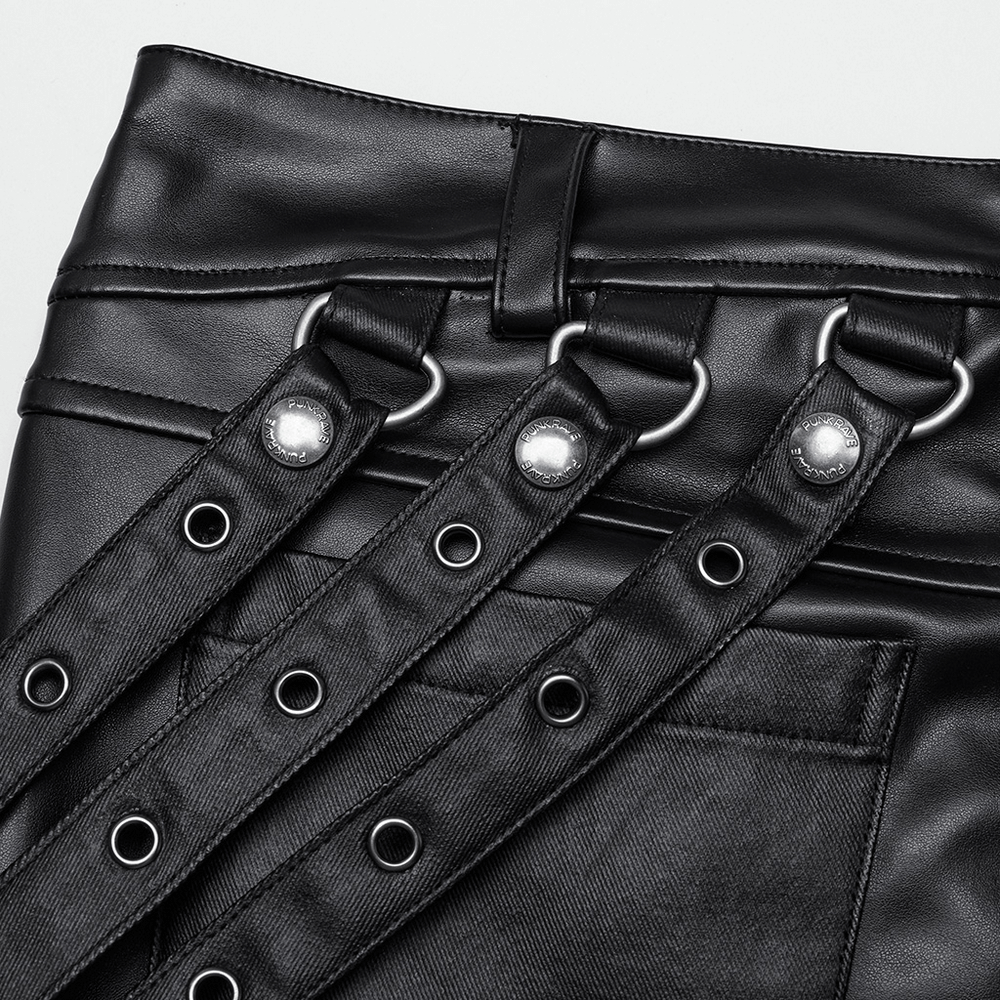 Close-up of black PU leather pants featuring adjustable buckle details and punk style accents.