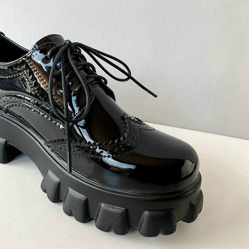 Black PU patent leather platform women's shoes with round toe and stylish laces, perfect for edgy alternative fashion.