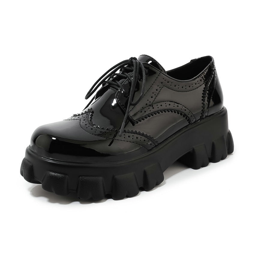 Edgy black PU patent leather platform women's shoes with square heel and round toe, perfect for alternative fashion.