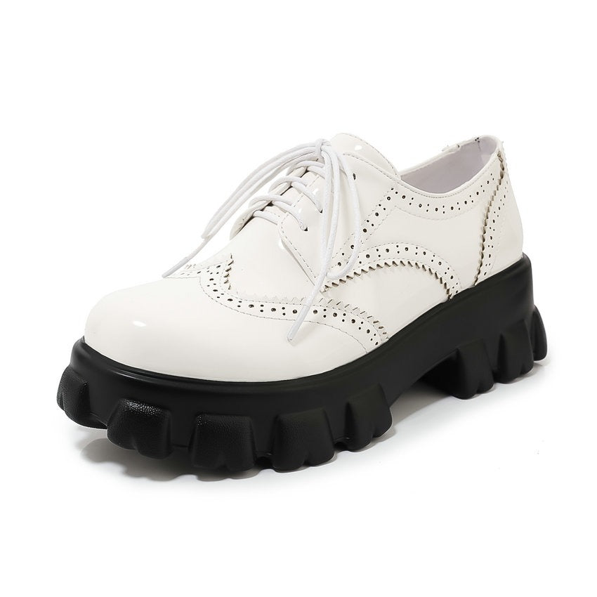 Stylish white PU leather platform shoes with a chunky black sole, featuring lace-up design, ideal for edgy spring and autumn outfits.