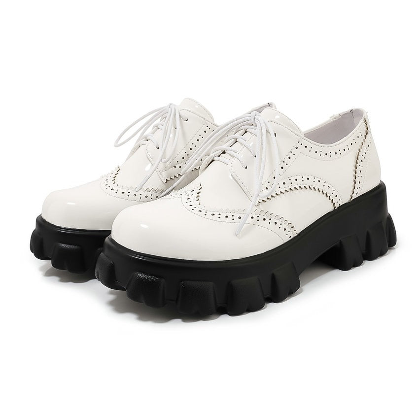 Edgy PU patent leather platform women's shoes with square heel, round toe, and stylish laces in black and white.