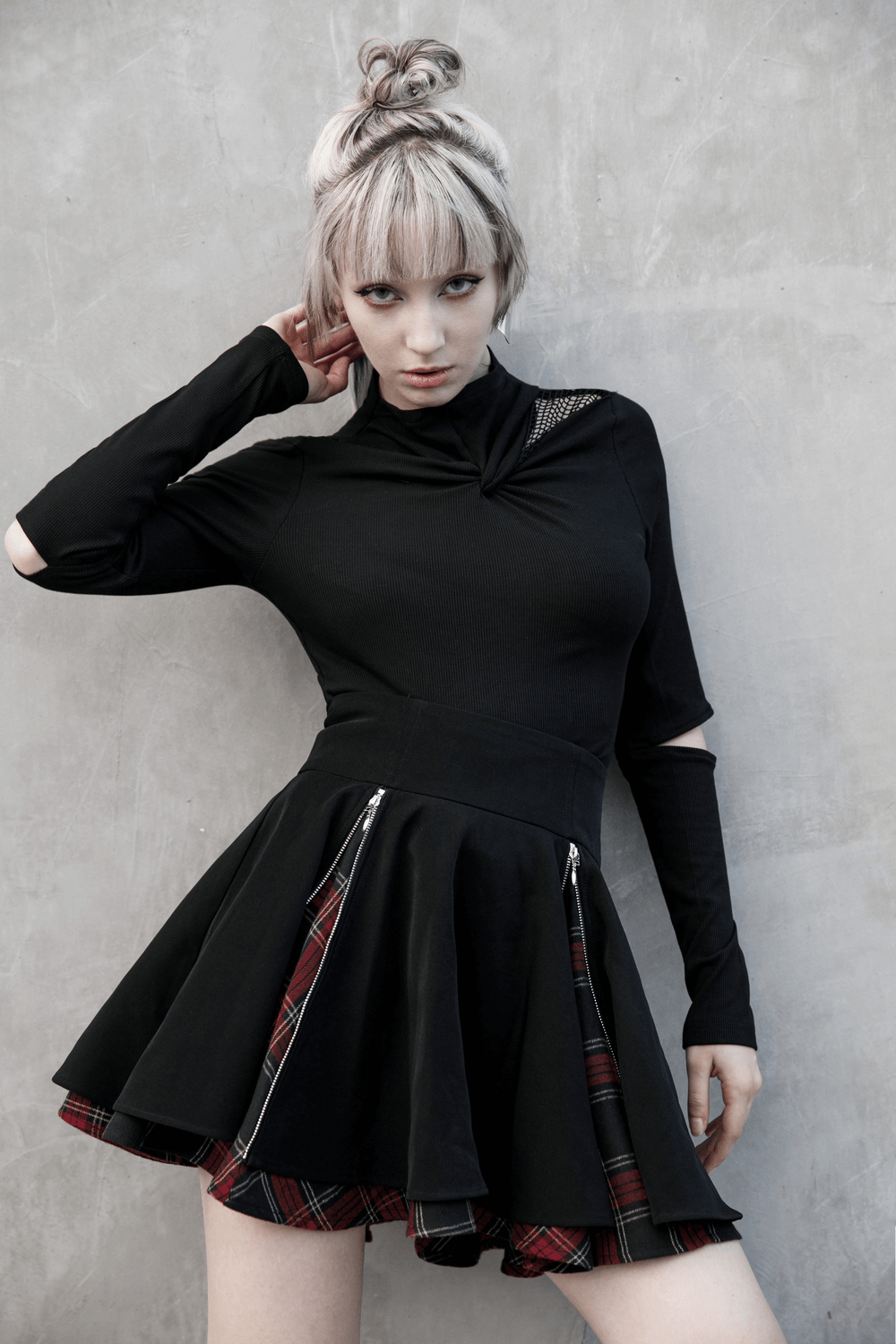 Punk A-Line skirt with side zippers and plaid detail worn by model, showcasing edgy fashion style.