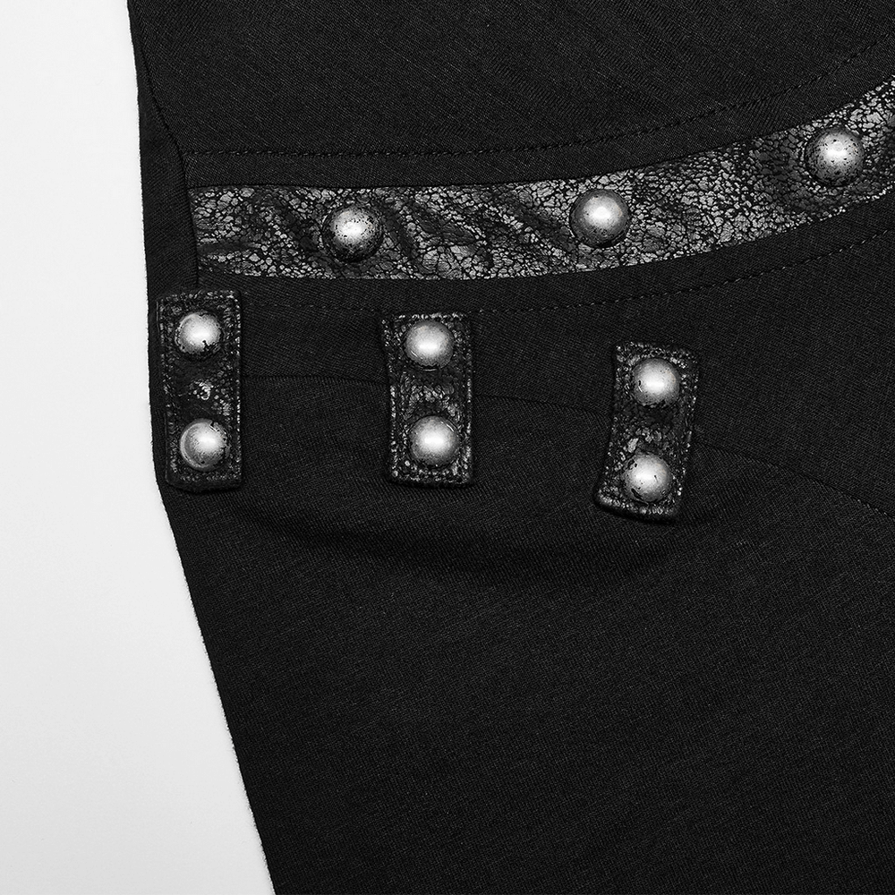 Punk T-shirt close-up showing cracked leather detail and rivets, highlighting edgy and unique style elements.