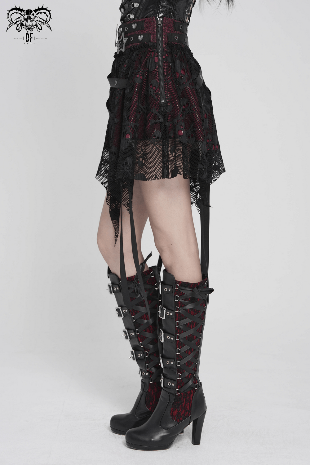 Punk Asymmetric Skirt with Belts and Star Buckles styled with knee-high corset lace-up boots.