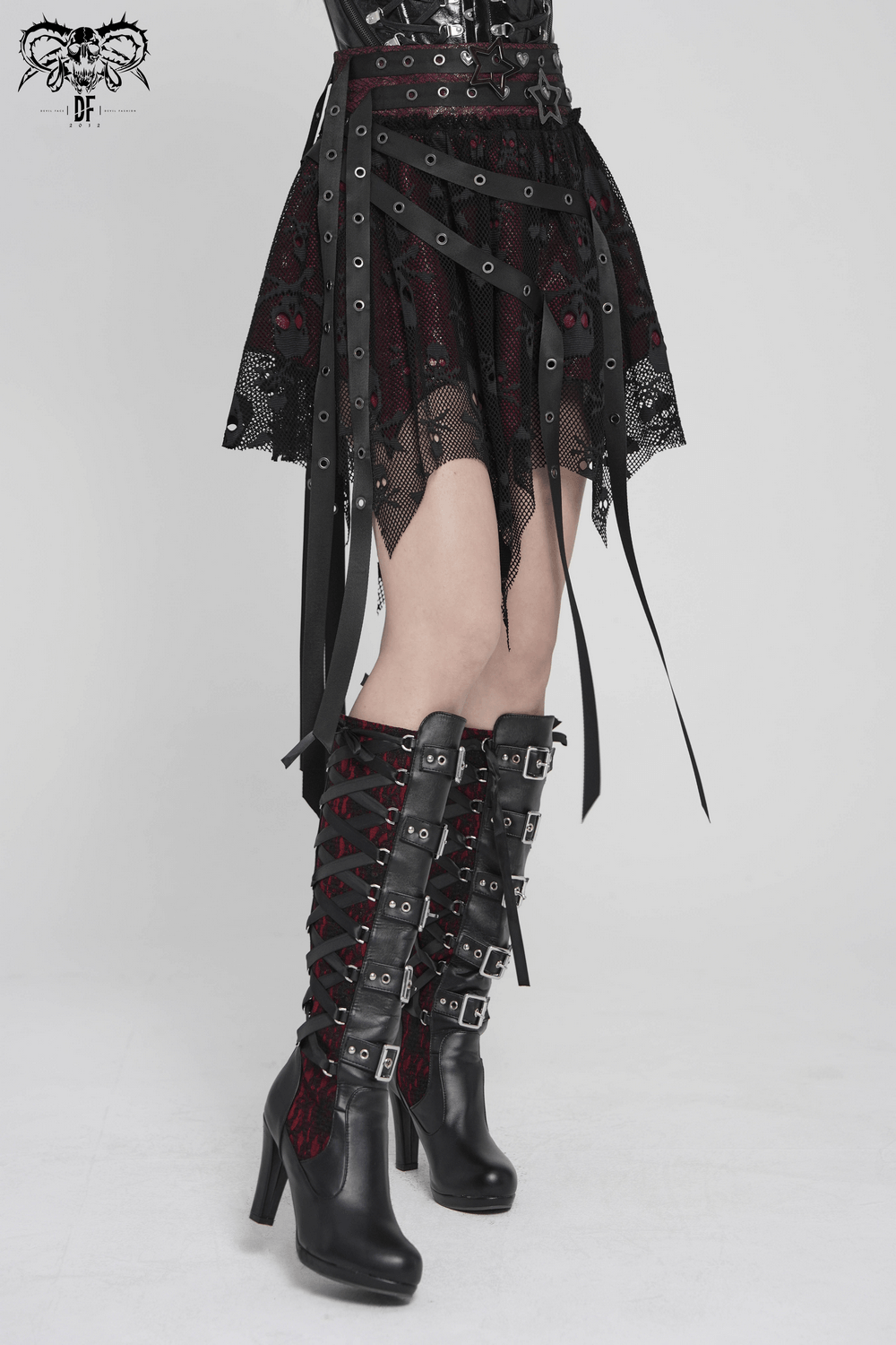 Punk Asymmetric Skirt with Belts and Star Buckles showcasing gothic lace and layered mesh paired with stylish platform boots.