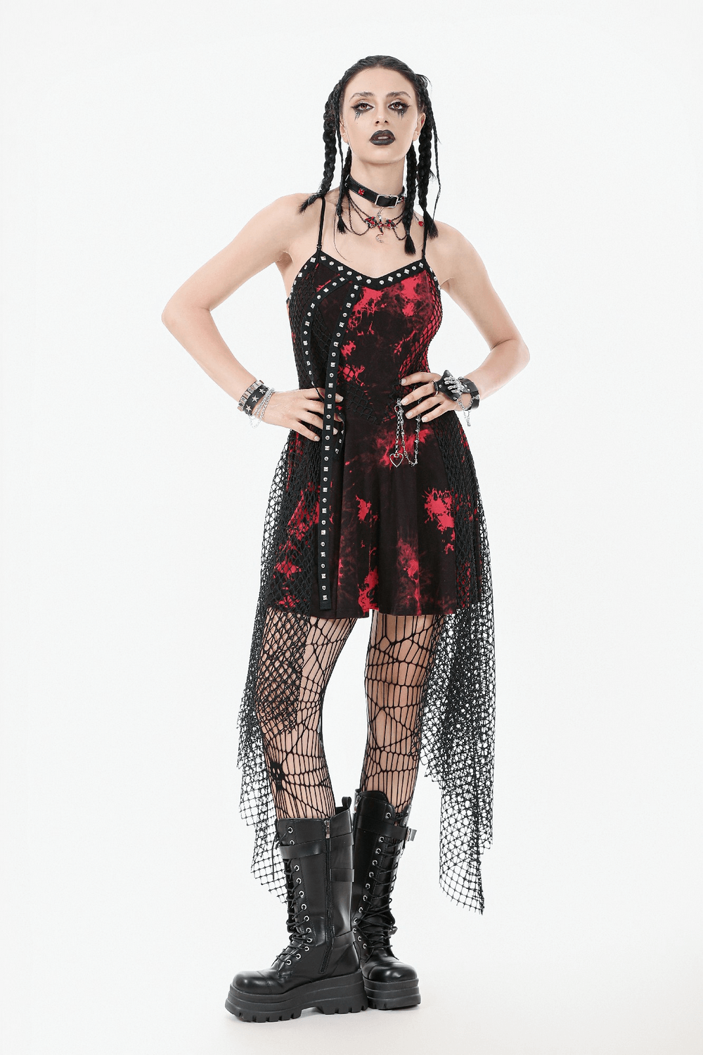 Punk asymmetrical dress with studded chain, fishnet, and tie-dye details, perfect for edgy goth fashion.