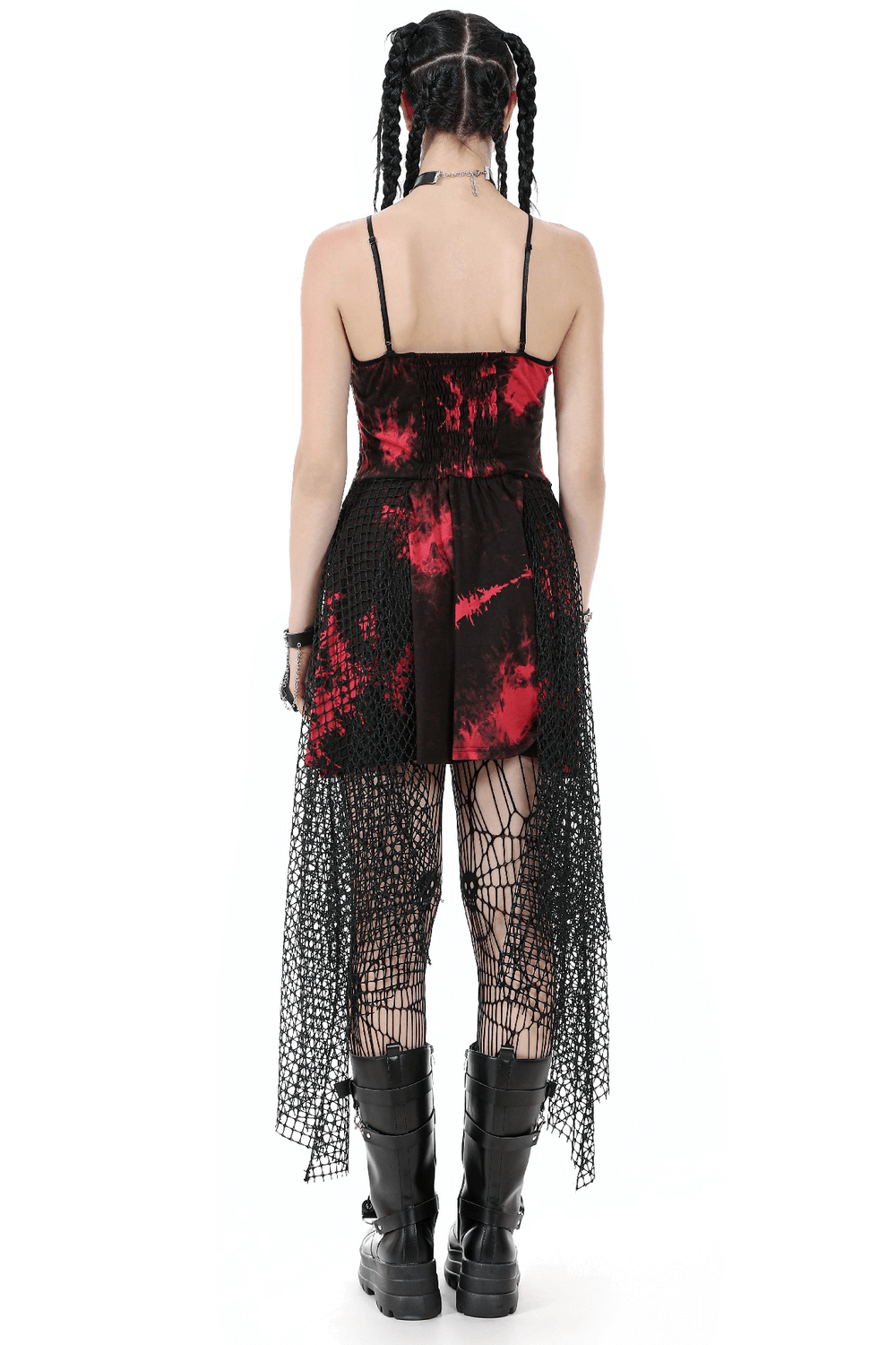 Back view of punk asymmetrical dress with fishnet skirt, strappy top, and studded chain, showcasing gothic style.