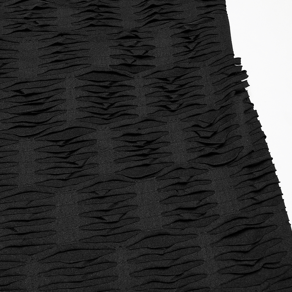 Textured black fabric showcasing unique pleats and layers for a dramatic, edgy look.