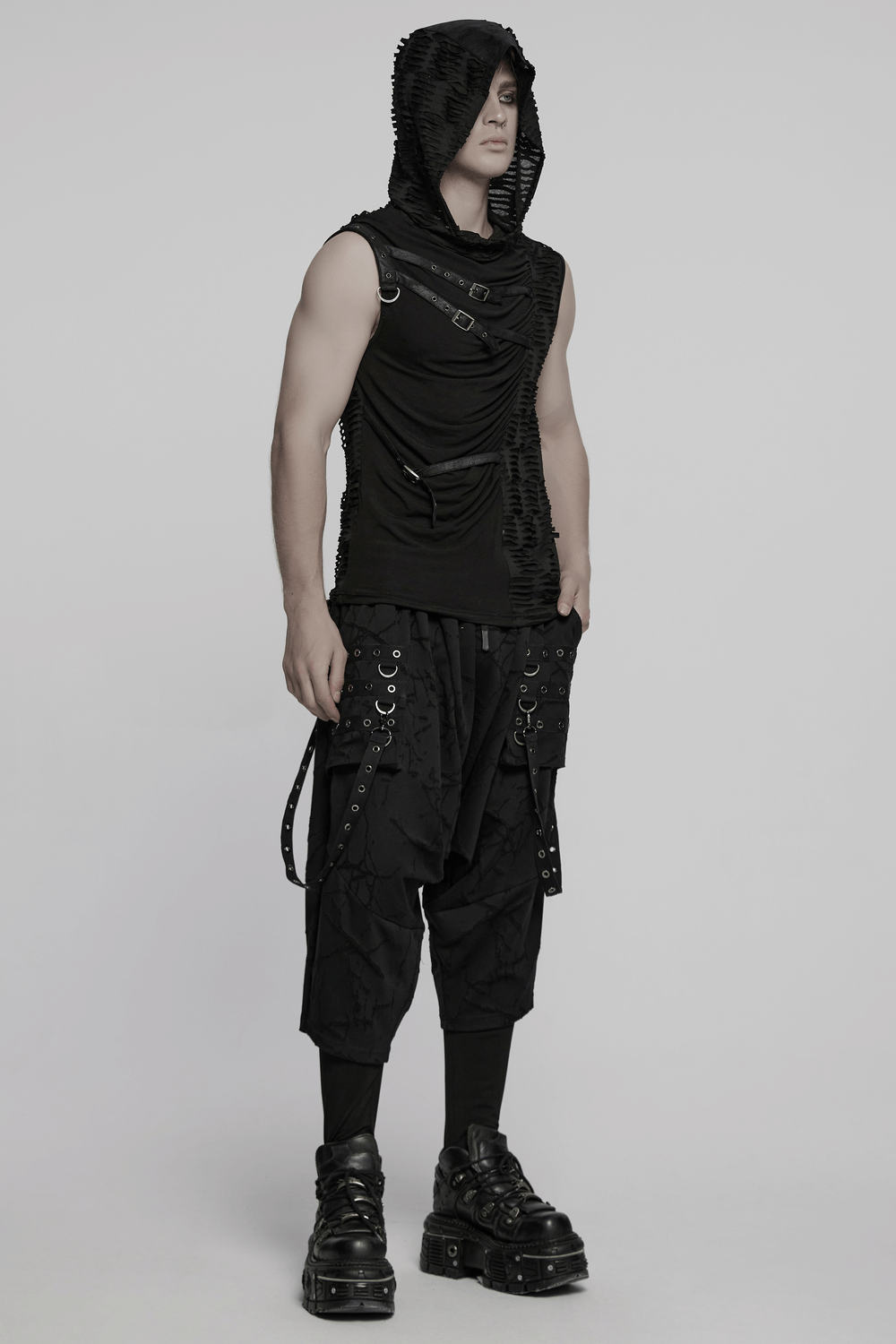 Model wearing a punk asymmetrical hooded top with rivets, showcasing a gothic streetwear look.