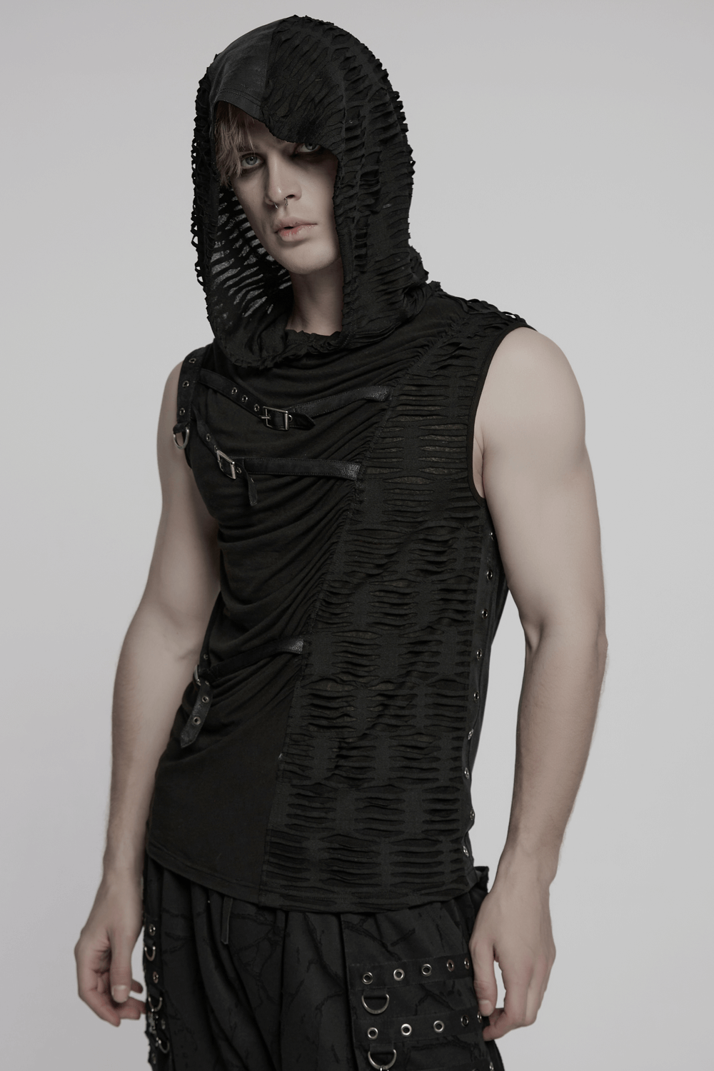 Punk asymmetrical hooded top with rivets and draped details, showcasing gothic streetwear style.