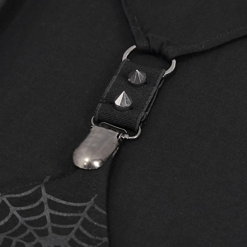 Close-up of punk-style black fabric with metal studs and spider web print, highlighting edgy design elements.
