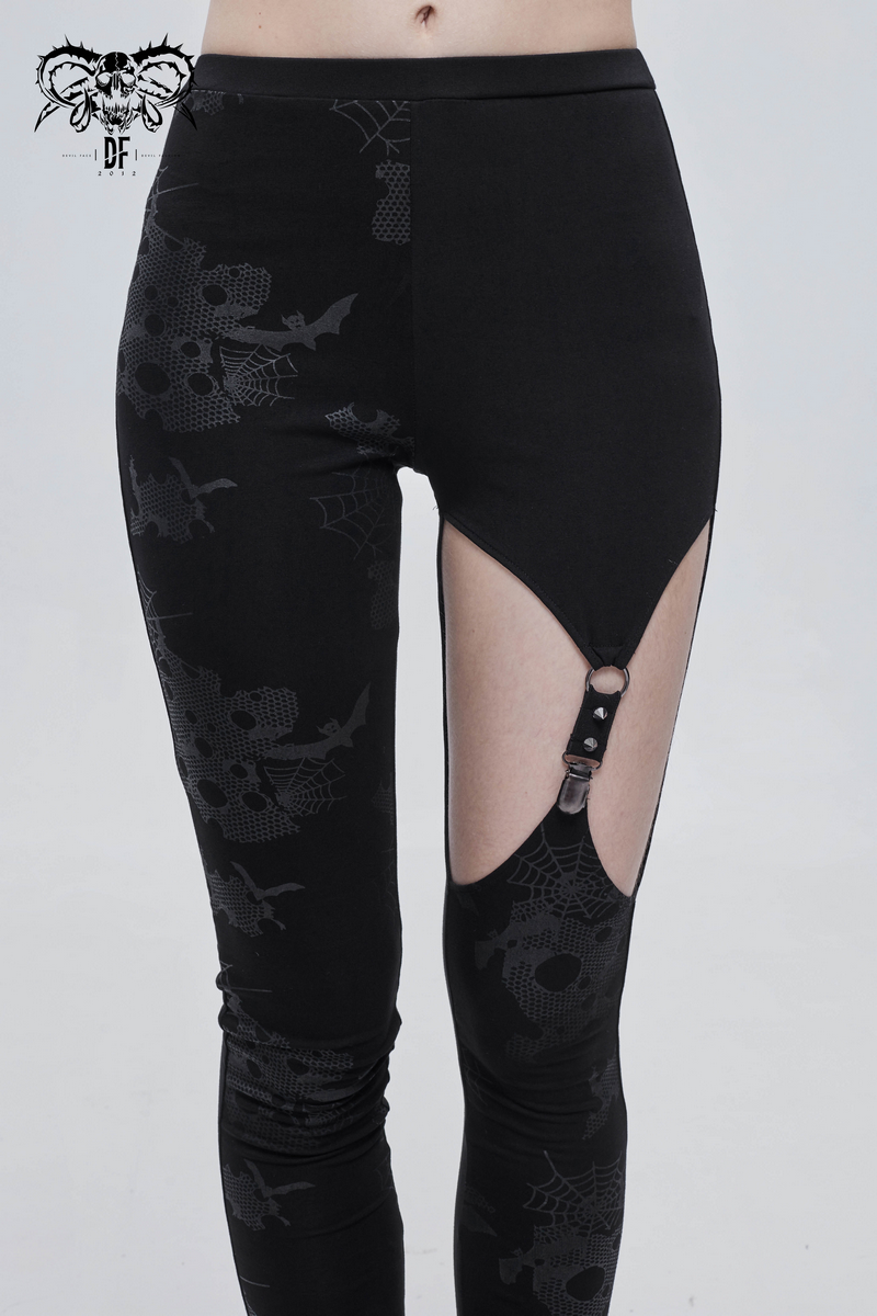 Punk asymmetrical black leggings with spiderweb print and cutout detail for women's fashion.
