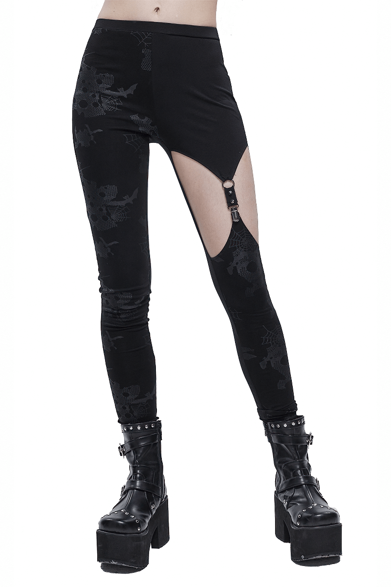 Womens punk black asymmetrical leggings with skull print and stylish cut-out design in a modern fashion style.