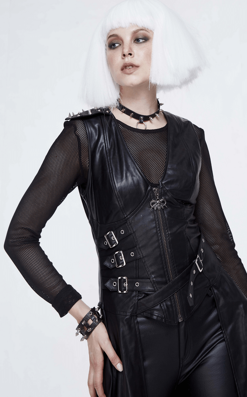 Model showcasing a punk-inspired black asymmetrical dress with spiked rivets and mesh sleeves.