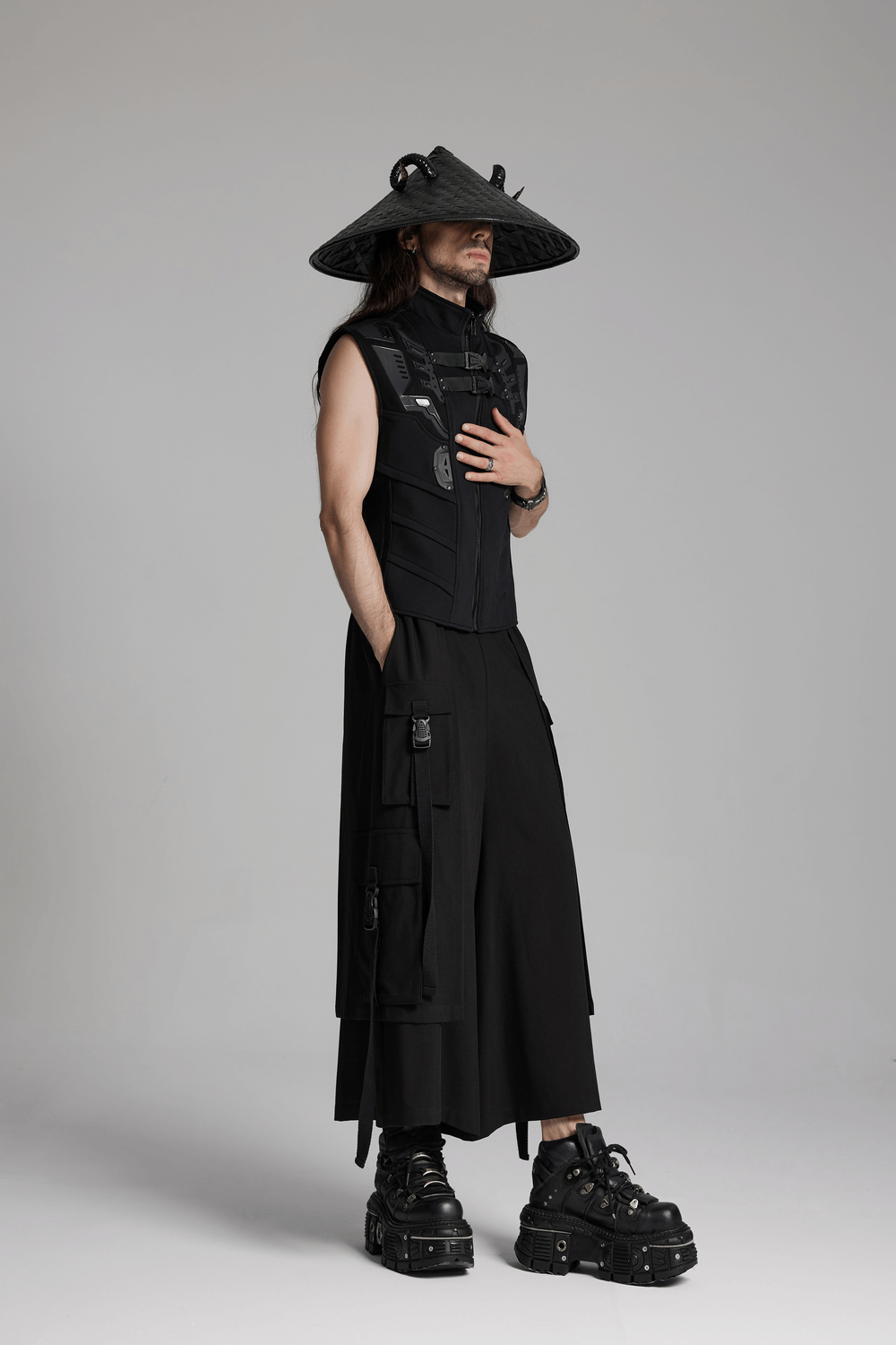 Model showcasing a punk black bamboo conical hat with horn accents and a dark aesthetic outfit.