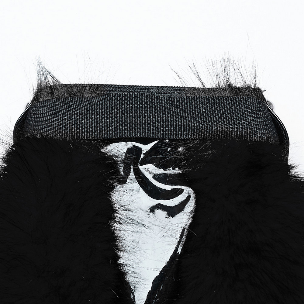 Close-up of punk black faux fur leg warmers with rivet details and adjustable buckle straps.
