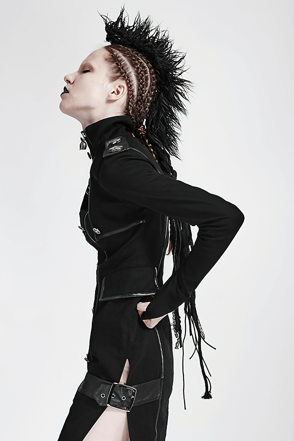 Model showcasing a punk black faux fur mohawk hair clip with braided hairstyle and edgy black outfit.