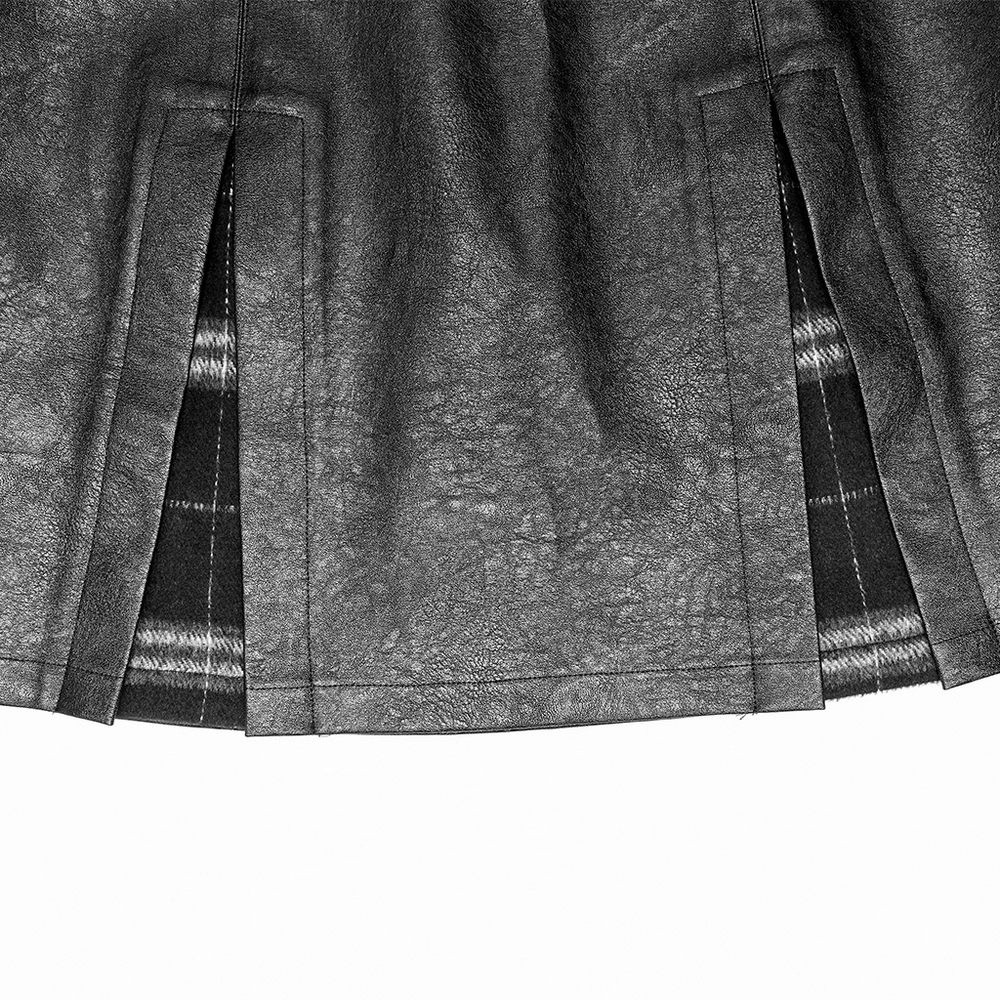 Close-up of the black faux leather A-line mini skirt with plaid lining and edgy side splits.