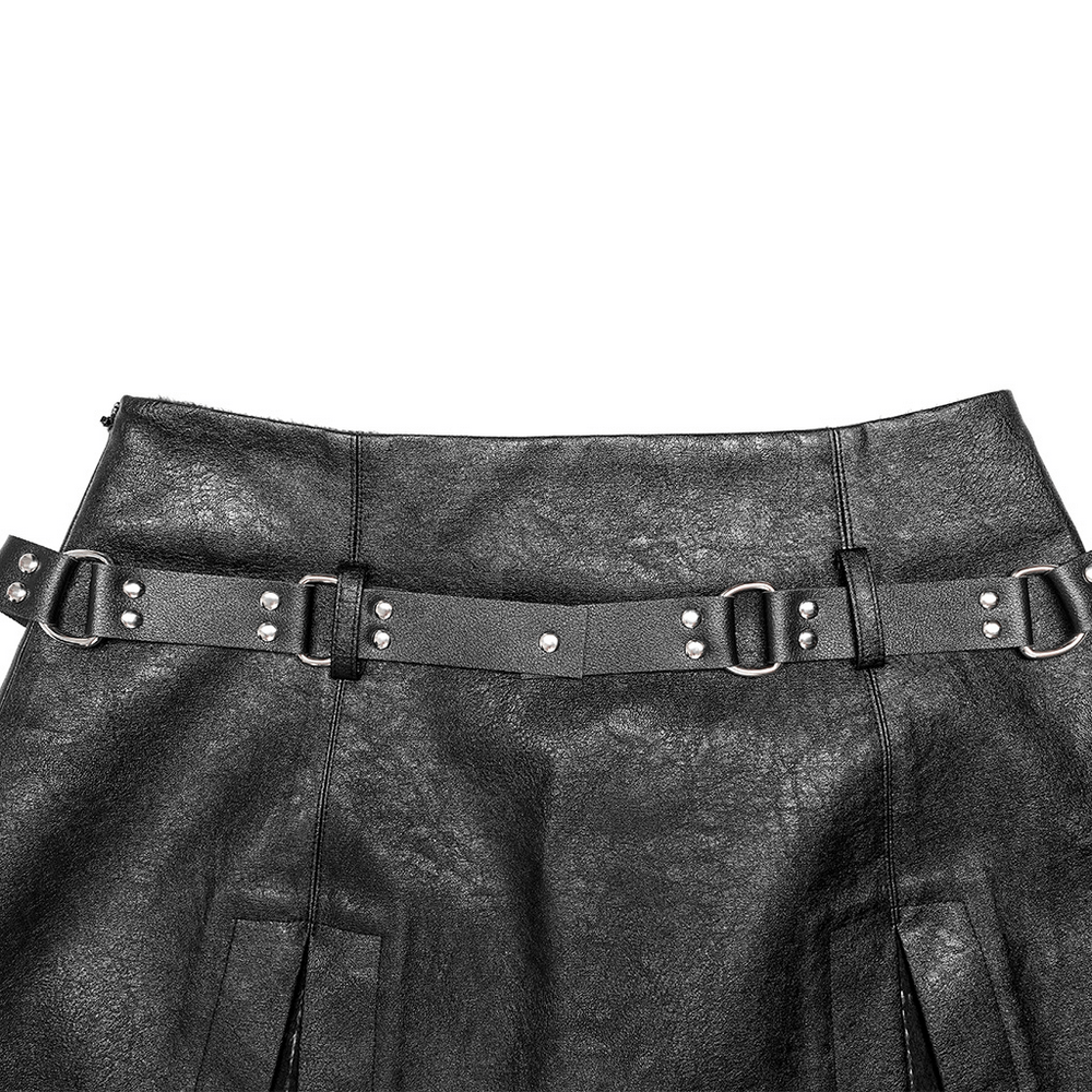 Close-up of a punk black faux leather A-line mini skirt featuring rivet details and adjustable waist belt.