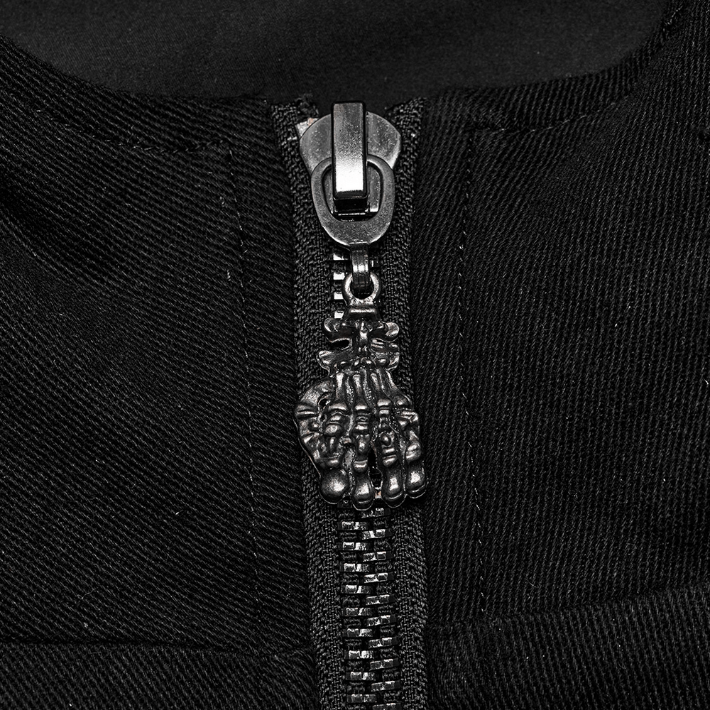 Close-up of black zipper with skull design pull on a punk-inspired hooded jacket.