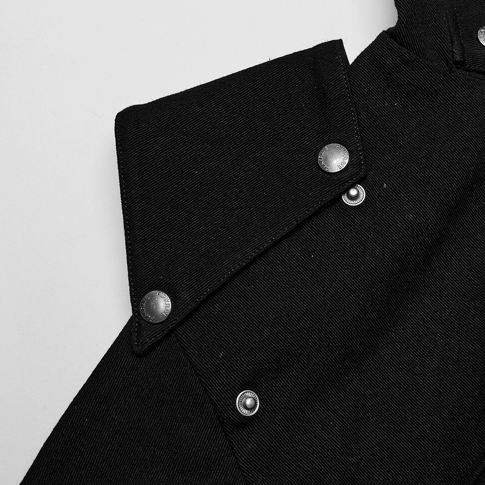 Close-up of black hooded jacket highlighting the reinforced shoulder patches and metallic snap buttons.
