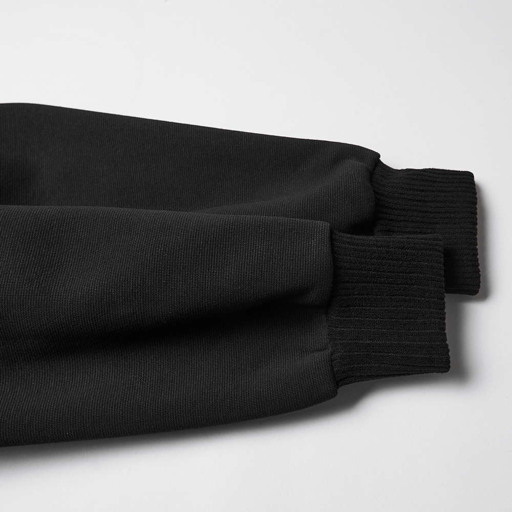 Close-up of the cuffs of a Punk Black Lace-Up Hoodie with Leather Shoulder Details, showcasing sleek black fabric.