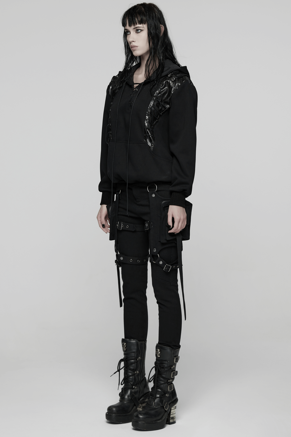 Punk Black Lace-Up Hoodie with Leather Shoulder Details worn by model showcasing gothic punk style in black outfit.