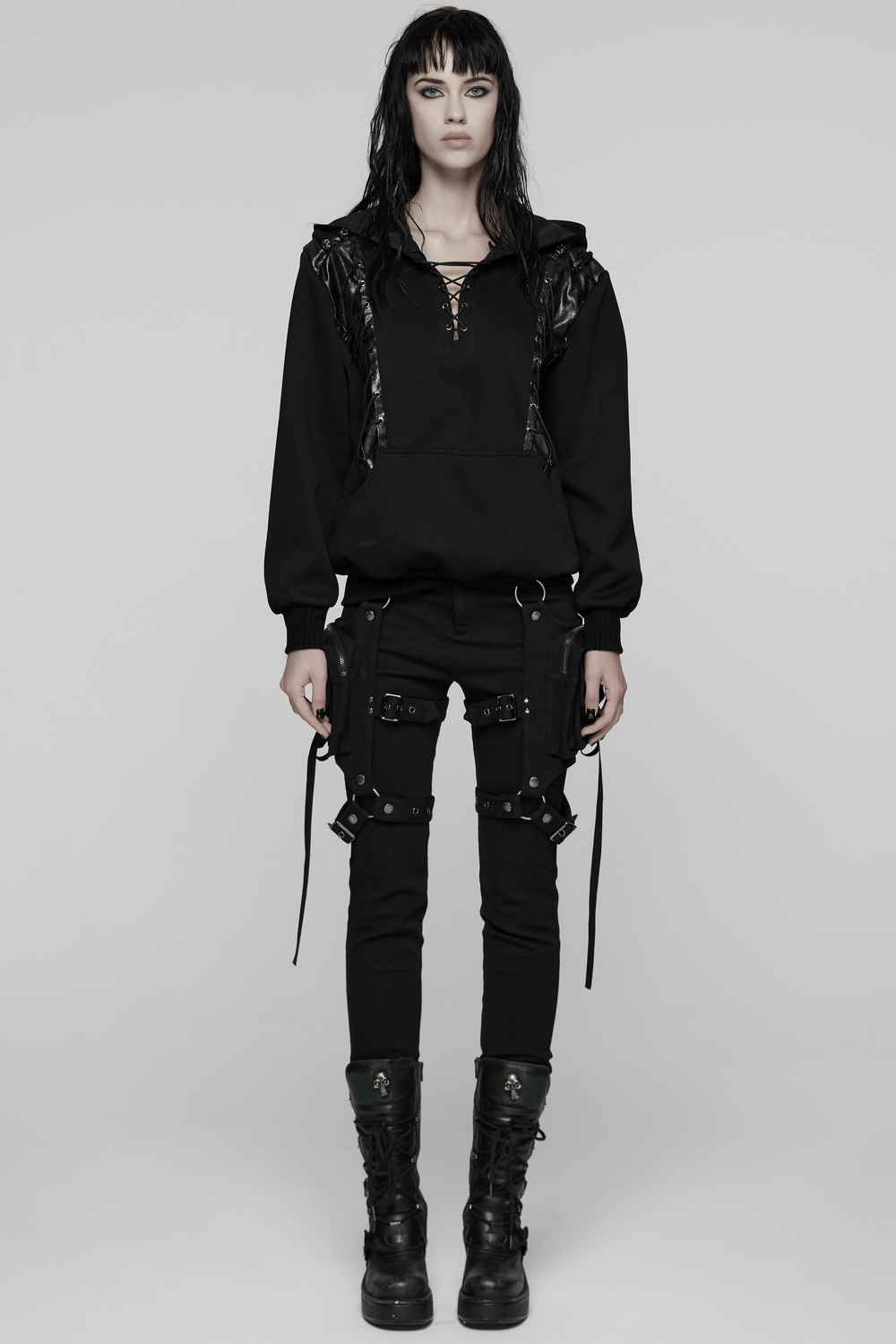 Punk Black Lace-Up Hoodie with Leather Shoulder Details worn by model, showcasing gothic style and edgy design.