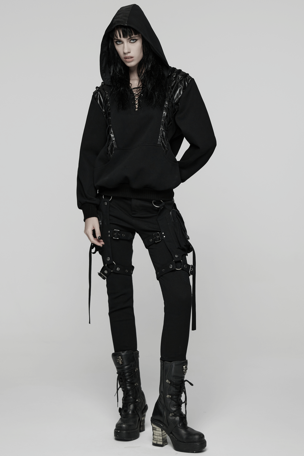 Punk Black Lace-Up Hoodie with Leather Shoulder Details worn by a model, showcasing gothic punk fashion and edgy styling.