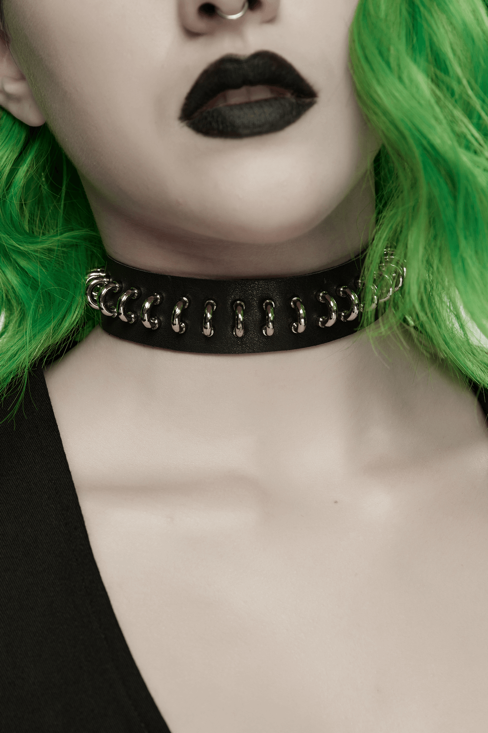 Punk Black Leather Choker with Metal Ring Details worn with green hair and black lipstick, showcasing a bold style.