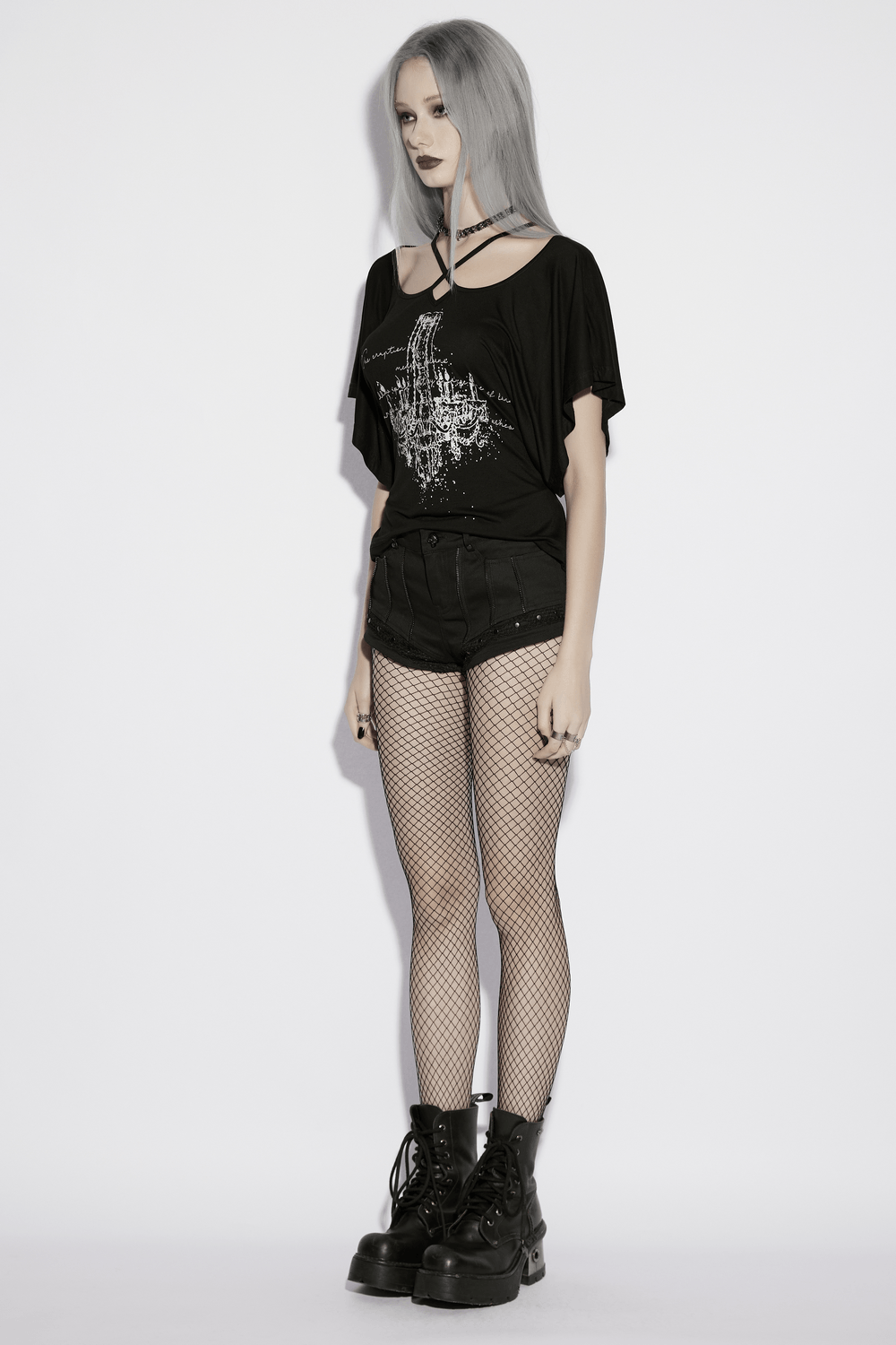 Alt Tag: Punk Black Low Waist Shorts with Zipper and Rivet Trim on model, mesh accents, edgy punk streetwear look
