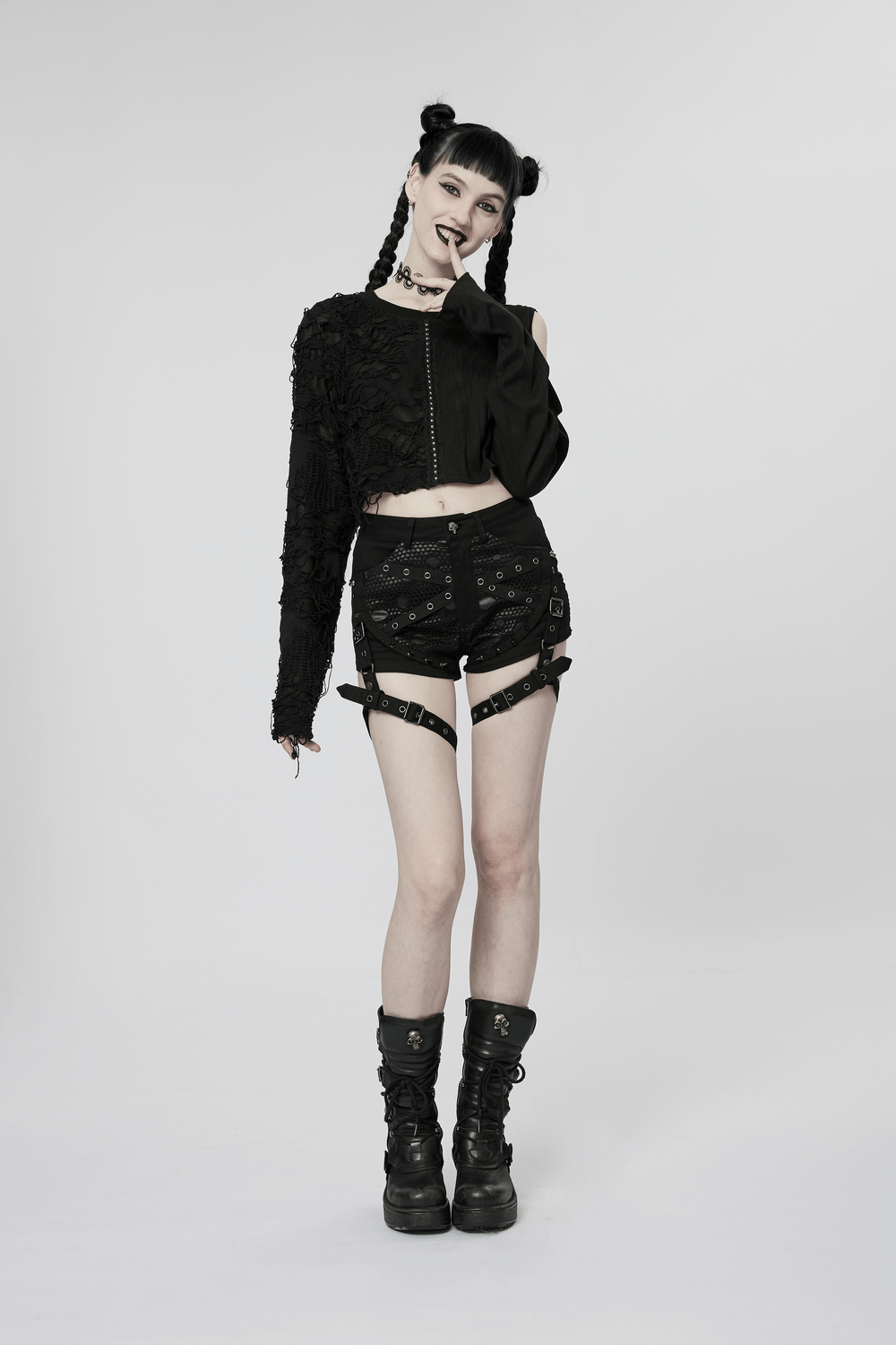 Model showcasing punk black mesh garter shorts with buckle straps and matching edgy outfit.